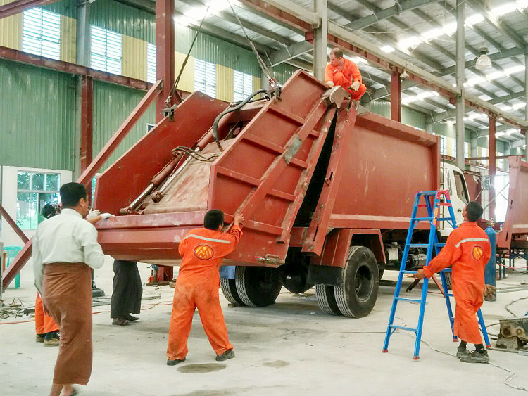 SPV technicians are preforming training on garbage compactor assembly in Myanmar.